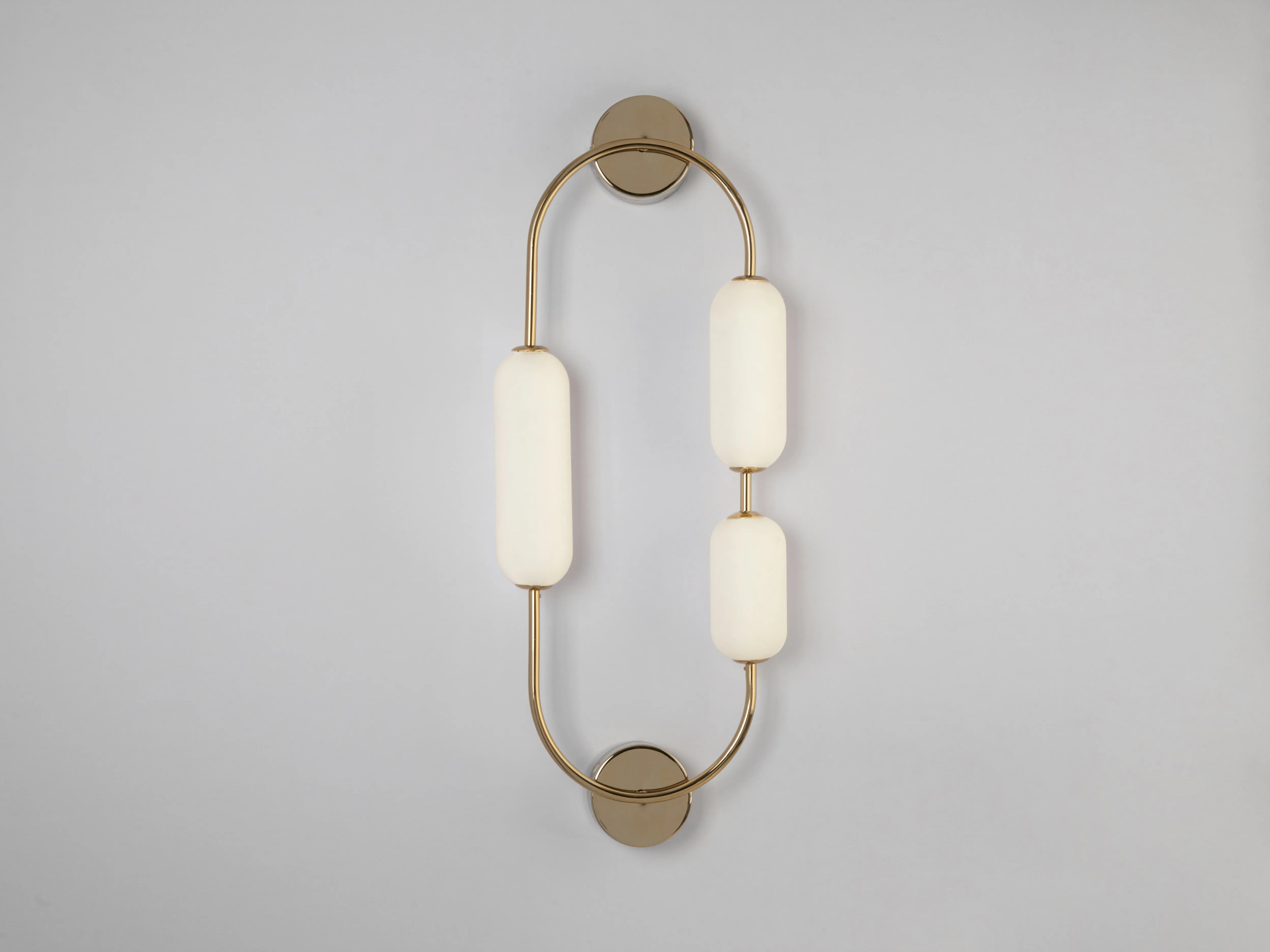 Brass oval pill wall light