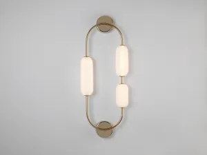 Brass oval pill wall light