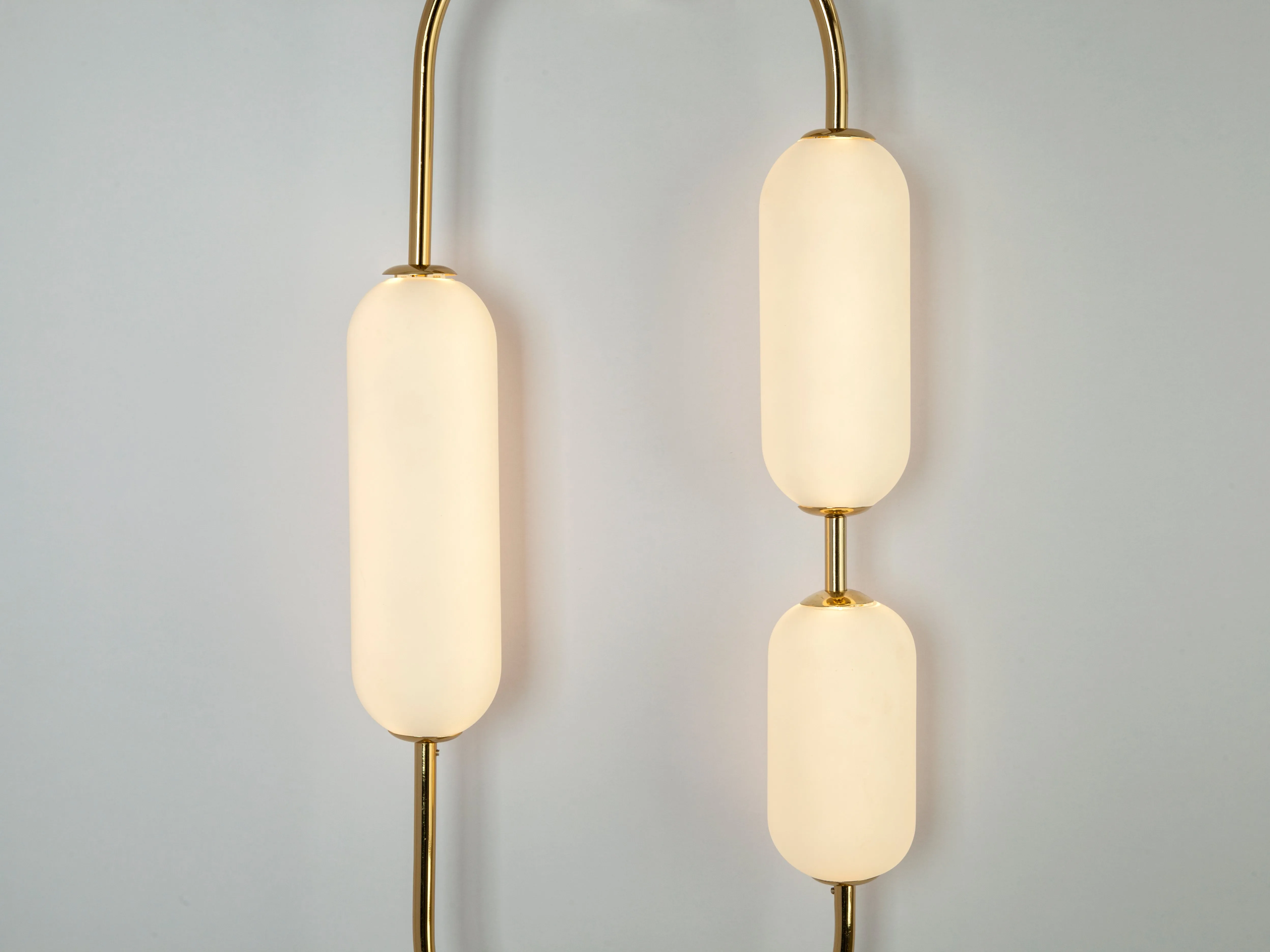 Brass oval pill wall light