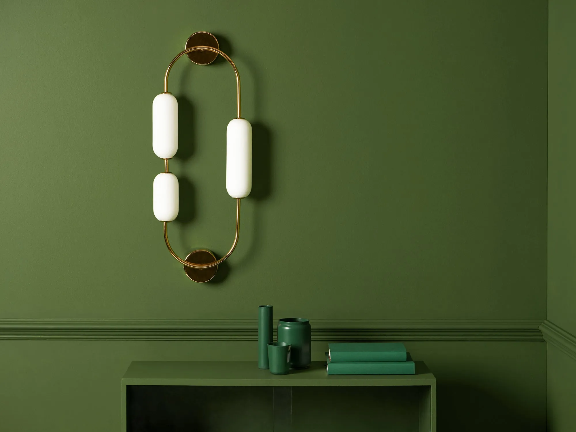 Brass oval pill wall light